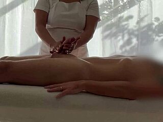 oiled asian babe massages caucasian cock to huge jizz blast