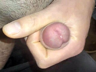European amateur close-up shows sticky slidy precum dripping from throbbing cock
