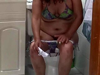 imagine your beautiful latina stepmom flashing her huge hairy pussy after pissing and washing those fat milf lips