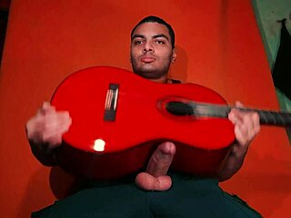 sexy chinese bodybuilder strokes monster cock on yamaha guitar in carrot glow