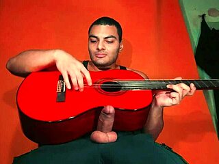 sexy chinese bodybuilder strokes monster cock on yamaha guitar in carrot glow