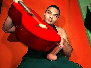 sexy chinese bodybuilder strokes monster cock on yamaha guitar in carrot glow