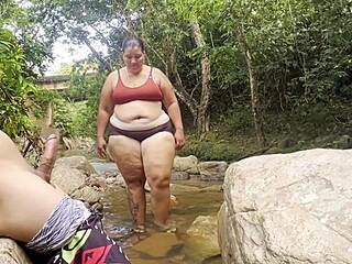 so this unknown latina pulls me to the river for a wet handjob then squeezes milk from her huge tits all over