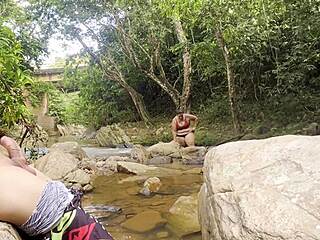 so this unknown latina pulls me to the river for a wet handjob then squeezes milk from her huge tits all over