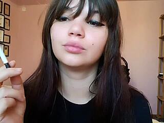 romanian femdom goddess smokes cigarette with big bare lips closeup pov