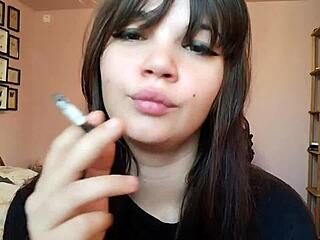 romanian femdom goddess smokes cigarette with big bare lips closeup pov