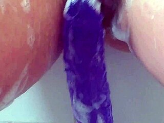 i'm in the bath SLIDING my big purple 12-inch dildo deep until i CUM hard