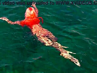 naked skinny babe flashes wet shaved pussy in blue water