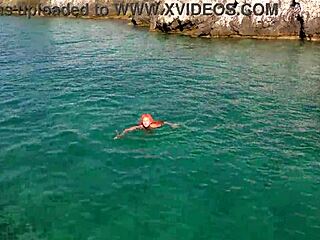 naked skinny babe flashes wet shaved pussy in blue water