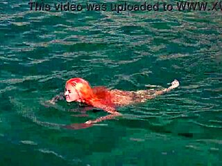 naked skinny babe flashes wet shaved pussy in blue water