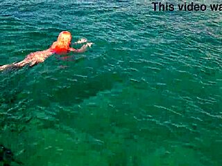 naked skinny babe flashes wet shaved pussy in blue water