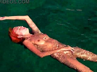 naked skinny babe flashes wet shaved pussy in blue water
