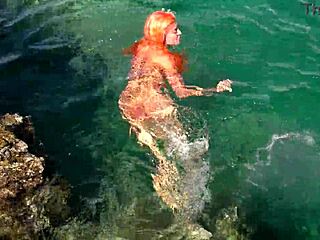 naked skinny babe flashes wet shaved pussy in blue water