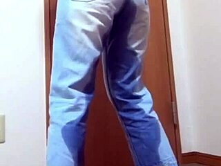 Desperate girl soaks jeans peeing while bro hogs the bathroom