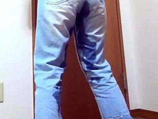 Desperate girl soaks jeans peeing while bro hogs the bathroom