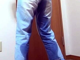 Desperate girl soaks jeans peeing while bro hogs the bathroom