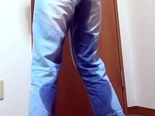Desperate girl soaks jeans peeing while bro hogs the bathroom