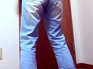 Desperate girl soaks jeans peeing while bro hogs the bathroom