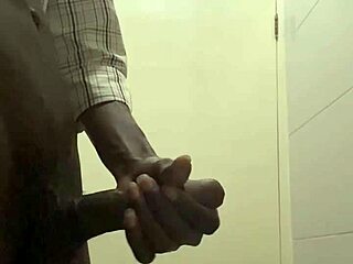 guy caught stroking cock in office bathroom