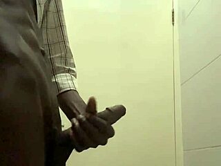 guy caught stroking cock in office bathroom