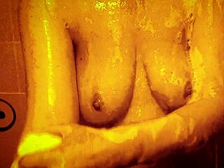 Feel the horny milf's wet nipples glisten as she massages her sexy tits in slow shower bliss.