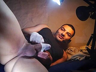 sexy bodybuilder in latex gloves strokes hard cock one two three times