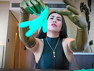 Mistress slips on latex gloves for steamy rubber fetish tease and domination play