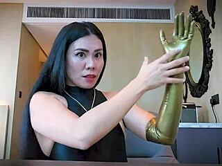 Mistress slips on latex gloves for steamy rubber fetish tease and domination play