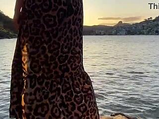 She flashes her bare pussy publicly on the beach.