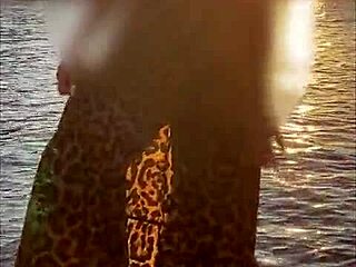 She flashes her bare pussy publicly on the beach.