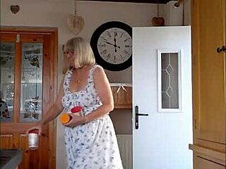 the housewife teases her delivery boy with her big bouncy tits.