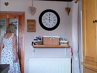 the housewife teases her delivery boy with her big bouncy tits.