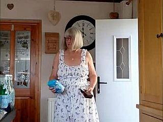 the housewife teases her delivery boy with her big bouncy tits.