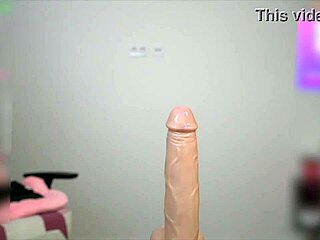 busty girl oils up and titfucks huge cock toy squeezing natural big tits tight