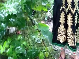 Huge titted stepmom rams big dildo in asshole outdoors in public rain.