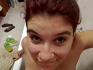 chiara's bathroom tease with golden shower on her full tits