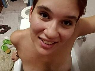 chiara's bathroom tease with golden shower on her full tits