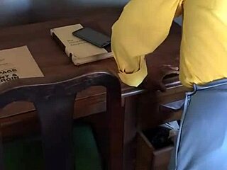 Domestic worker's secretive task unfolds beneath the office desk unexpectedly