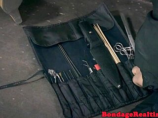 Bdsm sub tied to poles before dildo play
