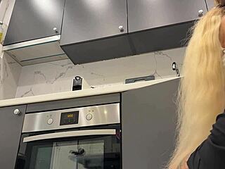 Hot tattooed blonde takes panties off in kitchen to show pussy