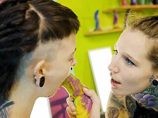 Tattooed girl trains shy teen with strap on