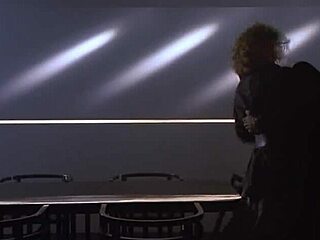 Kim basinger strips and teases on antique desk.