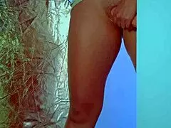 College Desi in sexy dress plays with glass dildo