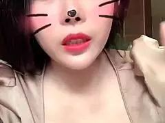 Asian girl shows off big tits in sexy live session