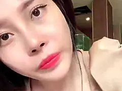 Asian girl shows off big tits in sexy live session