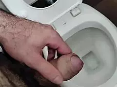 Hey dude, check out this guy jerking his small cock in the public bathroom solo