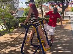 wife exposes her skinny ass in public park while husband watches in cuckold outdoor miniskirt scene.