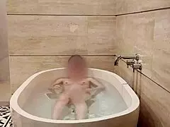 Hey, watch this cute Japanese college student bathing solo with her small tits and skinny body