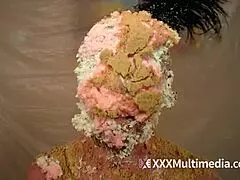 Two blondes get wet and messy while pieing each other in the face during a fun session