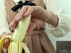 Watch this Asian girl crush a banana by hand in intense fetish style!